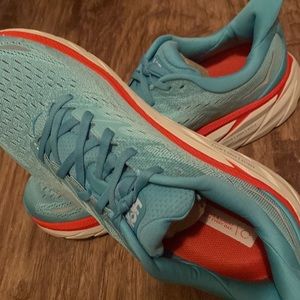 Hoka tennis shoes! Mainly turquoise with pink and white mixed in! Size 12 wide.